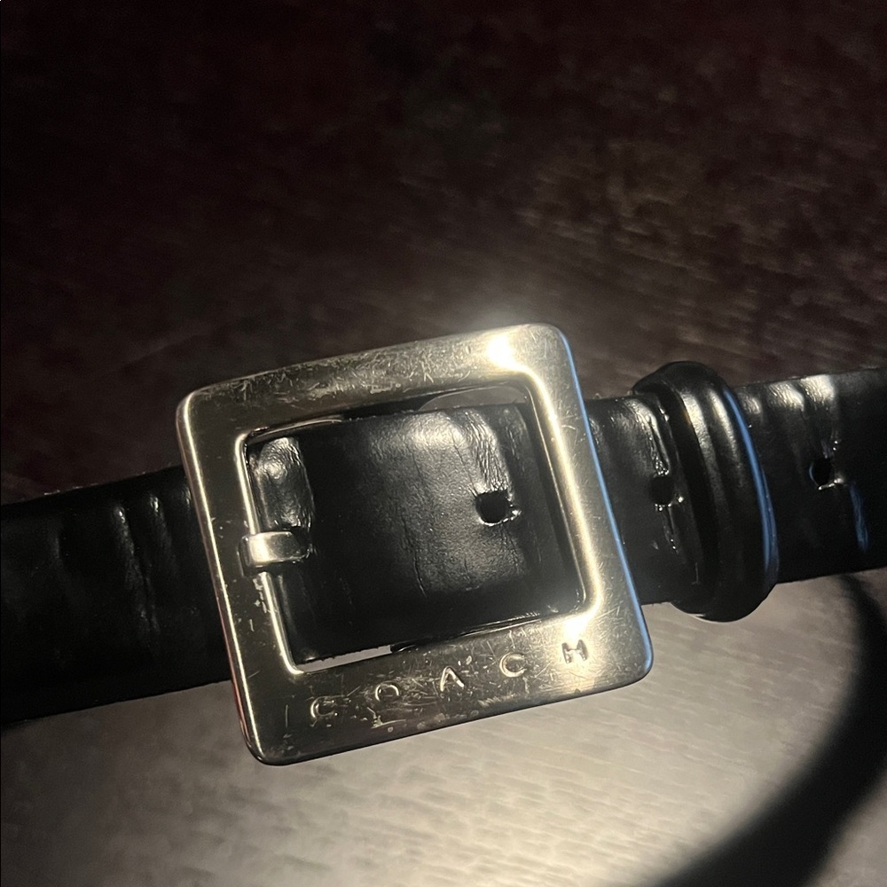 Stylish black belt. Labeled size large. Good used condition.